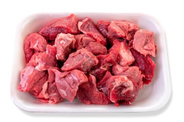 Raw beef diced for stew in food plastic tray for sale in supermarket,  isolated on white with clipping path included