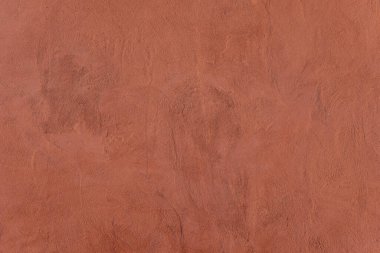 Texture of pink decorative plaster or concrete. Painted pink color stucco wall texture with copy space