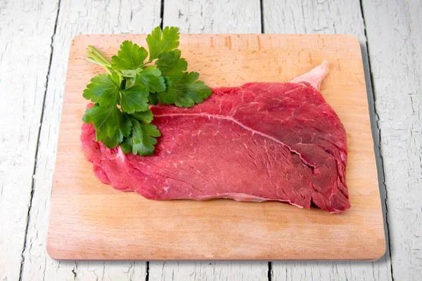 Raw Beef Steak Wooden Cutting Board Parsley Leaves Isolated White — Stockfoto