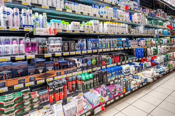 stock image Italy - May 25, 2023: Beauty and cosmetics products on shelves in Italian supermarket aisle. Packs of men's beard products, deodorant sprays and depilatory products on sale