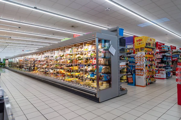 stock image Italy - May 25, 2023: large refrigerated counter with fresh products such as pasta and cheese inside Italian supermarket