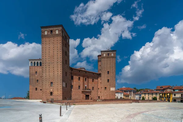 Stock image Fossano, Italy - July 10, 2023: Castle of the Princes of Acaja (14th century) in Castle Square on blue sky with white clouds