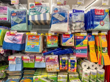 Italy - January 02, 2024: rags for washing floors of various types and brands packaged and displayed for sale in Italian supermarket
