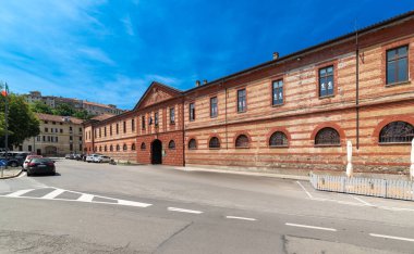 Saluzzo, Italy - June 06, 2024: Former Mario Musso Savoy Barracks now home to the socio-cultural hub called Il Quartiere (the district) clipart