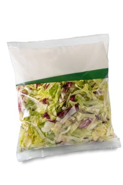 Lettuce and chicory salad cut and washed ready to eat in plastic bag for sale in supermarket, isolated on white with clipping path included clipart