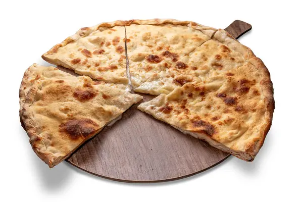 stock image Focaccia from Recco, Liguria, Italy. Flat bread made with flour and olive oil filled with Soft Cheese, slices on wooden cutting boardboard isolated on white, clipping path