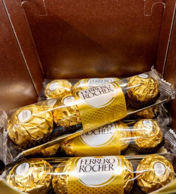 Italy - February 03, 2025: Ferrero Rocher chocolates in exposed packaging for sale in supermarket clipart