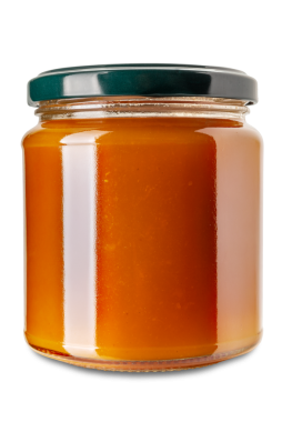 Yeşil kapaklı cam kavanozda kayısı reçeli