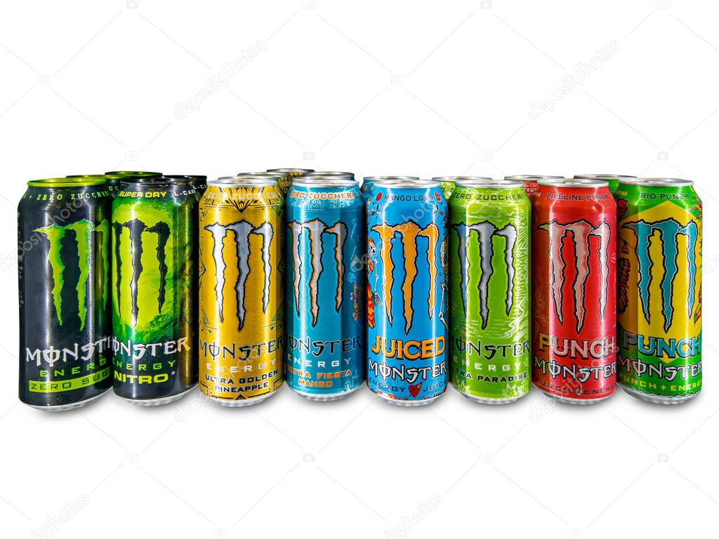 Italy - October 4, 2025:  selection of Monster Energy energy drink cans on a white background