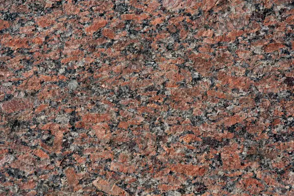 Sıcak kırmızı ve gri tonlara sahip eşsiz bir granit yüzey. Mimari başyapıtlara ilham veren doğal doku..