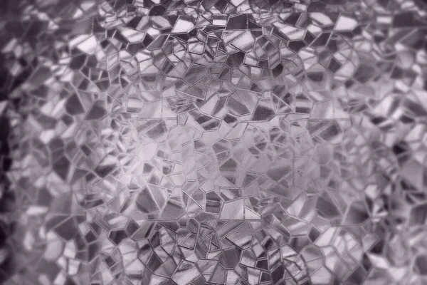 Embossed glass background. Corrugated glass sepia monochrome. Refraction of light in a bumpy transparent surface under backlight. The play of highlights. Black brown areas. Abstract background.