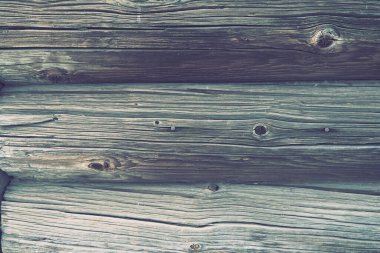 Background horizontal logs. Wooden background from shabby boards and logs. Round lumber assortment. General purpose lumber. Special type of forest products. Knots and branches