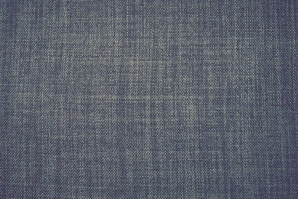 gray background fabric texture. A piece of woolen cloth is neatly laid out on the surface. Weave and textile texture. Dress fabric or for kitchen needs, tablecloth or curtains, close-up. Dash.