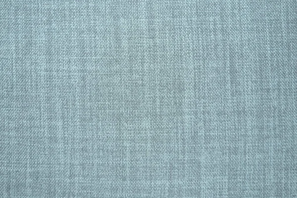 blue gray background fabric texture. A piece of woolen cloth is neatly laid out on the surface. Weave and textile texture. Dress fabric or for kitchen needs, tablecloth or curtains, close-up. Dash.