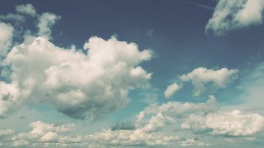 Fast-moving cumulus, Cirrostratus and stratocumulus Sc clouds against blue sky.   Changing of the climate. Angelic cotton clouds