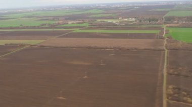 Belgrade, Serbia, January 19, 2023. Shot from the window of an aircraft. Terminal airport Nikola Tesla in Surcin. Decrease and landing of the aircraft. Landing route. Aviation signs and field
