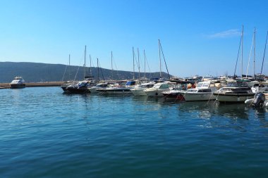 Meljine, Herceg Novi, Montenegro, August 13 2022 Boats, yachts and ships are at anchor. Moored ships in the parking lot. Adriatic Sea Mediterranean. Travel business. Sea travel and sports. Summertime