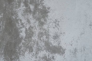 Alçılı duvar dokusu. Beyazlatıcı yüzey. Soyut arkaplan. Retro duvar yapı dokusu inşa etti. Beton duvarda çatlaklar ve tümsekler var. Su bazlı boyayla renklendirilmemiş. Eski püskü alçı..