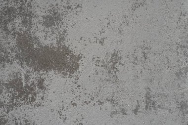 Alçılı duvar dokusu. Beyazlatıcı yüzey. Soyut arkaplan. Retro duvar yapı dokusu inşa etti. Beton duvarda çatlaklar ve tümsekler var. Su bazlı boyayla renklendirilmemiş. Eski püskü alçı..