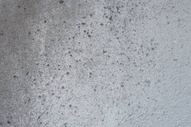 Alçılı duvar dokusu. Beyazlatıcı yüzey. Soyut arkaplan. Retro duvar yapı dokusu inşa etti. Beton duvarda çatlaklar ve tümsekler var. Su bazlı boyayla renklendirilmemiş. Eski püskü alçı..