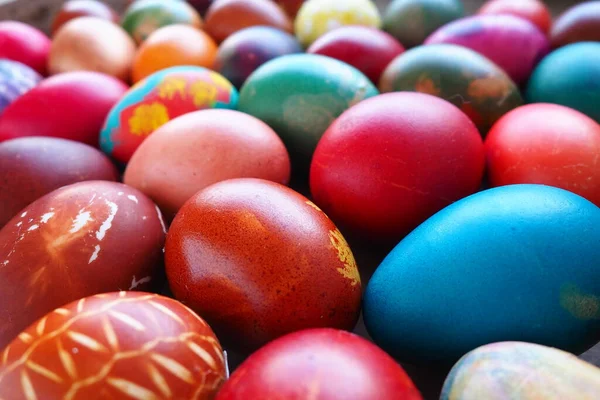 stock image Easter colorful eggs close up. Many colorful holiday eggs are stacked close to each other. Boiled chicken eggs with floral and fantasy pattern. Bright Easter background