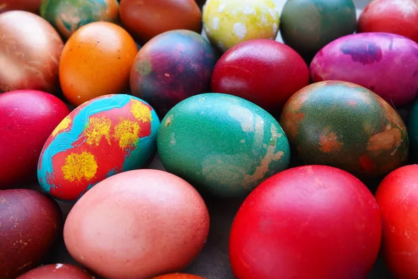 stock image Easter colorful eggs close up. Many colorful holiday eggs are stacked close to each other. Boiled chicken eggs with floral and fantasy pattern. Bright Easter background