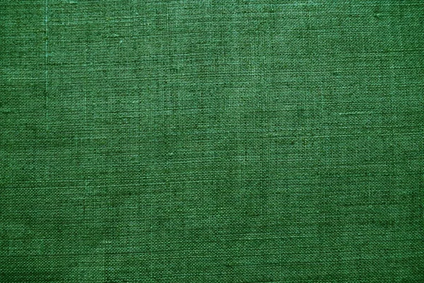 面料纹理背景 用编织的绿色织物 这种材料的外观自然略带皱纹 统一的复制空间背景 平铺在表面上的棉 帆布或羊毛织物 — 图库照片