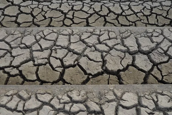 The ground has cracks in the top view for the background or graphic design with the concept of drought and death. Drought is the phenomenon of prolonged shortage of water. Sedentary high anticyclone.