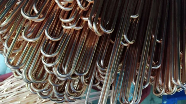 Copper tubes for heat exchangers. Copper heat exchangers are important in solar thermal heating cooling systems due to copper high thermal conductivity, mechanical strength. Lots of pipes to produce.
