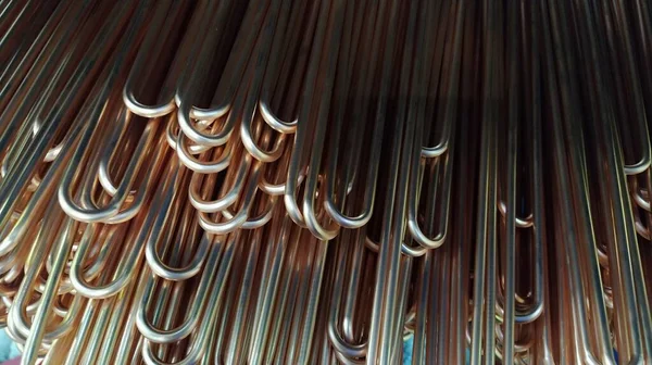 Copper tubes for heat exchangers. Copper heat exchangers are important in solar thermal heating cooling systems due to copper high thermal conductivity, mechanical strength. Lots of pipes to produce.