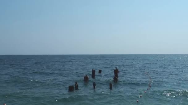 Ruined Pier Backdrop Deep Sea Wooden Poles Stick Out Blue — Vídeo de Stock