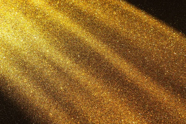 Golden gradient. Dusty gold color. Golden luxury, elegant beauty. Premium abstract background. Shiny, shimmering. Christmas, Happy New Year or birthday. Oblique light rays, photons and radiation