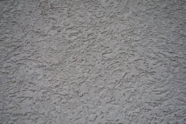 Alçı arka plan deseni. Alçı, duvarların ve tavanların koruyucu veya dekoratif kaplamalarında ve kalıp ve döküm elementlerinde kullanılan bir yapı malzemesidir. Bina cephesi.