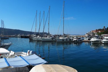 Meljine, Herceg Novi, Montenegro, August 13 2022 Boats, yachts and ships are at anchor. Moored ships in the parking lot. Adriatic Sea Mediterranean. Travel business. Sea travel and sports. Summertime