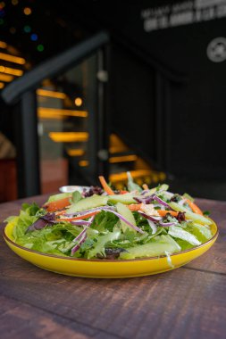Delicious and fresh Greek style salad with tomatoes, onions and green apples