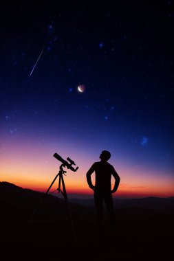 Man with astronomy telescope looking at the night sky, stars, planets, Moon and shooting stars.