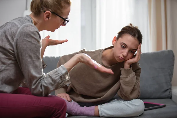 stock image Mother talking with difficult teenager daughter at home.