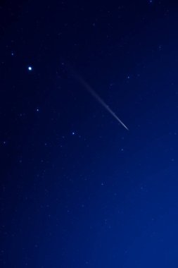 Starry Milky Way skies with comet and meteor shower, falling and shooting stars. clipart