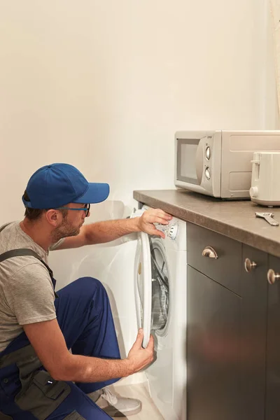 Handyman Fixing Broken Washing Machine Apartment Royalty Free Stock Images