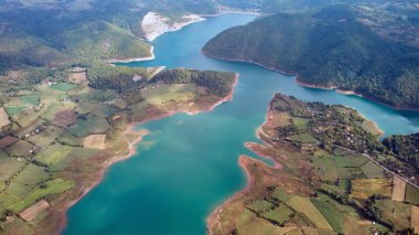 Vew of countryside lake Rovni, Serbia and hilly landscape in autumn colors. clipart