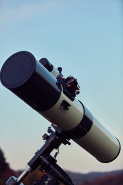 Amateur astronomy telescope for observing stars, planets and other celestial bodies. clipart