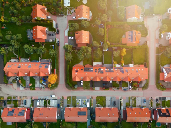 A beautiful estate of single-family houses and terraced houses. View from the drone of a housing estate