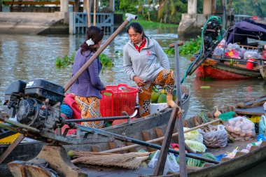 Can Tho, Vietnam - January 4, 2023: Fruit and vegetable vendors at the Phong Dien floating market in the Mekong River Delta in Can Tho, Vietnam.