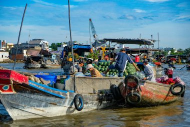 Can Tho, Vietnam - January 4, 2023: Fruit and vegetable vendors at the Cai Rang floating market in the Mekong River Delta in Can Tho, Vietnam.