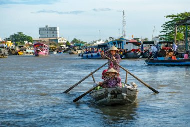 Can Tho, Vietnam - January 4, 2023: Fruit and vegetable vendors at the Cai Rang floating market in the Mekong River Delta in Can Tho, Vietnam.
