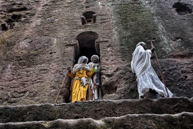 Lalibela, Ethiopia - January 7, 2018: Pilgrims leaving the Biete Meskel (House of the Cross). During the first days of January, thousands of Ethiopian Orthodox Christian pilgrims go to the city of Lalibela in Ethiopia. clipart