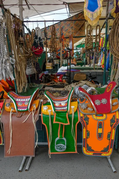 stock image Ulaanbaatar, Mongolia - August 2, 2023: Saddles in the Narantuul Market, also known as the Black Market, in Ulaanbaatar, Mongolia.