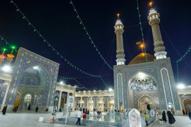 Qom, Iran - April 6, 2024: People visiting the Fatima Masumeh Shrine in Qom, Iran. Fatima Masumeh was the sister of Imam Reza, one of the twelve imams in Islam. clipart