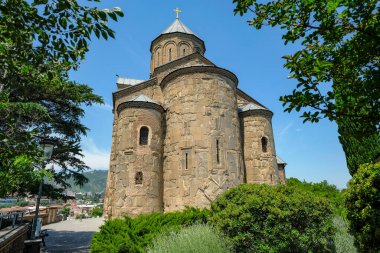 Tbilisi, Georgia - June 7, 2024: The Metekhi church of the Nativity of the Mother of God, known simply as Metekhi, in Tbilisi, Georgia. clipart