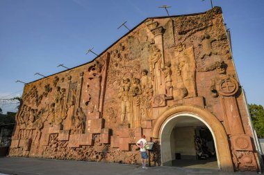 Kutaisi, Georgia - July 8, 2024: The Kolkheti relief, also known as the Kutaisi Market relief, was created by the Georgian artist Bernard Nebieridze in 1985 in Kutaisi, Georgia. clipart